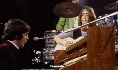 Man Playing Piano Says Remember with Drum Set