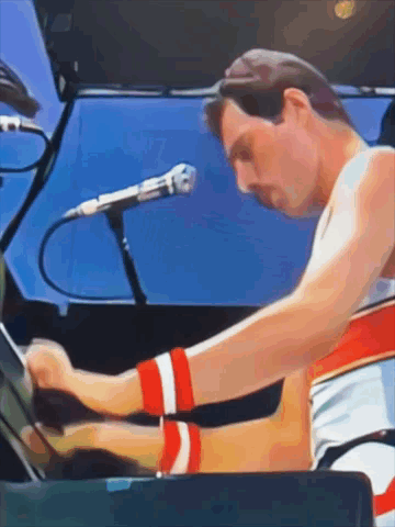 Man Playing Piano with Microphone