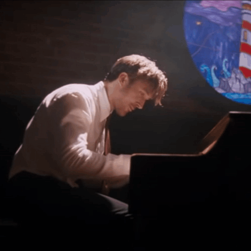 Man Playing Piano With Stained Glass Window GIF
