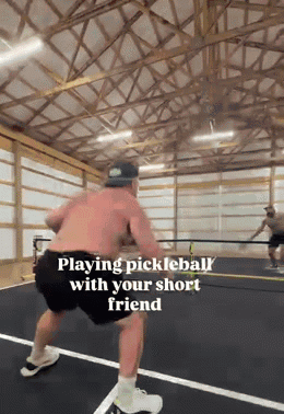 Man Playing Pickleball With Short Friend