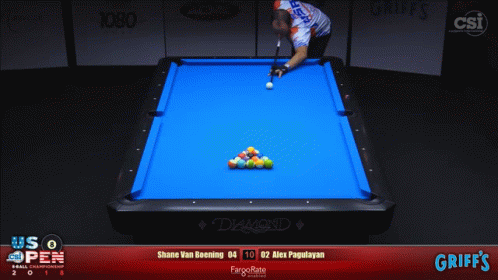 Man Playing Pool on Blue Pool Table