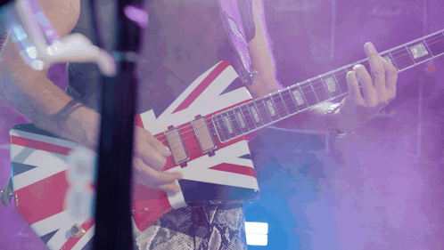Man Playing Red White and Blue British Flag Guitar