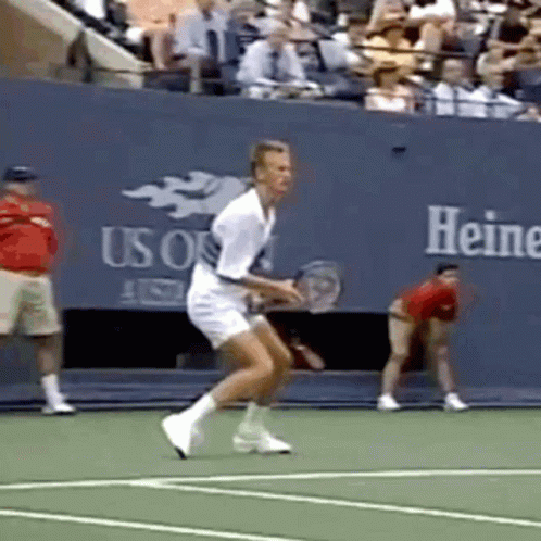 Man Playing Tennis In Front Of Heine Wall GIF