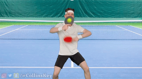 Man Playing Tennis on Blue Court with Twitter @ Collinskey Watermark