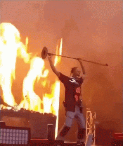 Man Playing Trumpet in Flaming Background