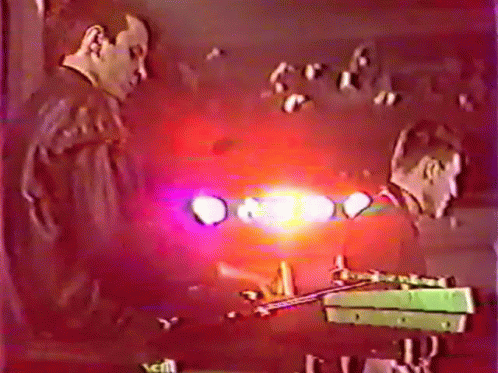 Man Playing Trumpet in Front of Crowd