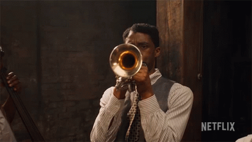 Man Playing Trumpet With Netflix Logo
