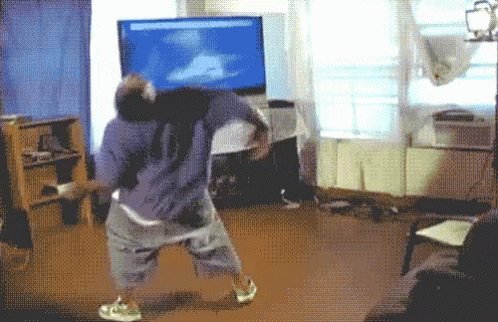Man Playing Video Game on Large Flat Screen TV