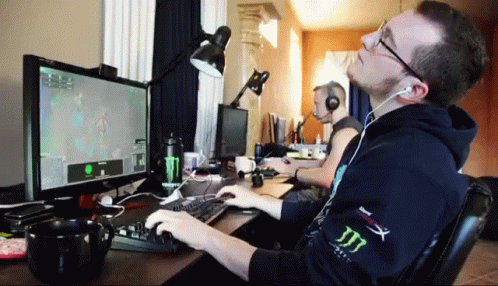 Man Playing Video Game With Headphones