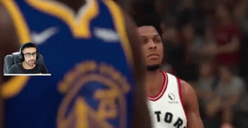 Man Playing Video Game with Raptors Jersey