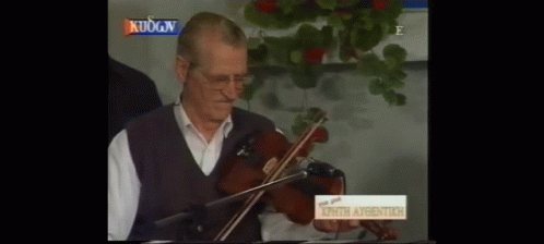 Man Playing Violin In Front Of Sign Kuogn GIF