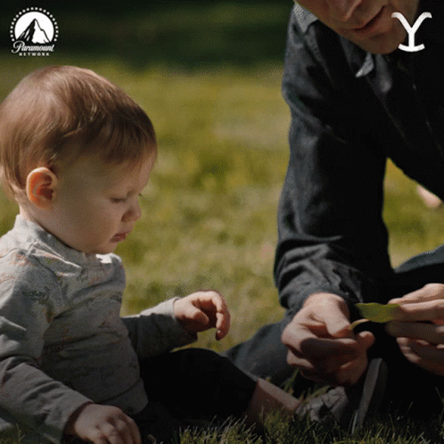 Man Playing With Baby in Grass and Paramount Network Logo