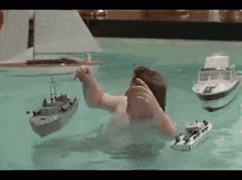 Man Playing With Boats GIF