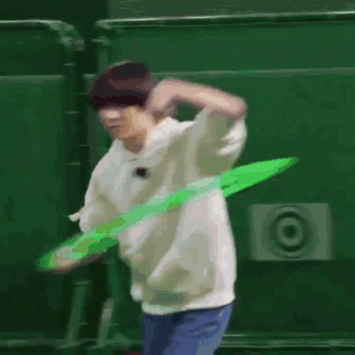 Man Playing With Green Hula Hoop