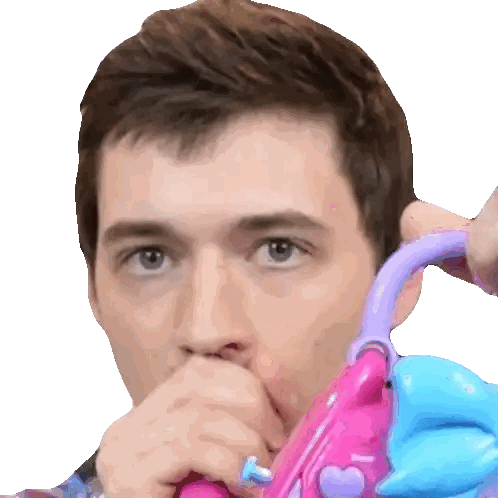 Man Playing with Pink and Purple Toy