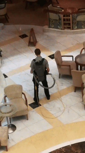 Man Playing With Vacuum GIF