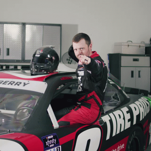 Man Pointing at Camera in Xfinity Race Car