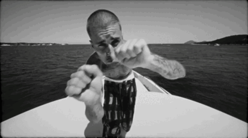 Man Pointing At Camera On Boat GIF