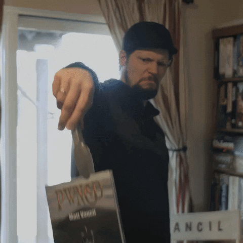 Man Pointing at Pwnso Book