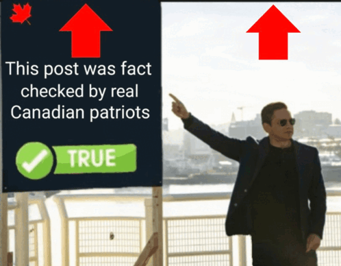 Man Pointing at Sign This Post Was Fact Checked by Real Canadian Patriots