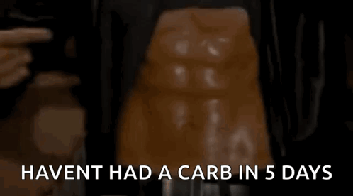 Man Pointing At Stomach Haven't Had A Carb In 5 Days