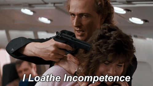 Man Pointing Gun at Woman Loathing Incompetence
