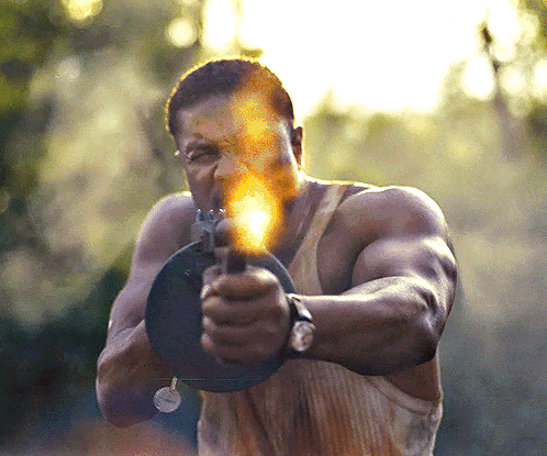 Man Pointing Gun with Flame