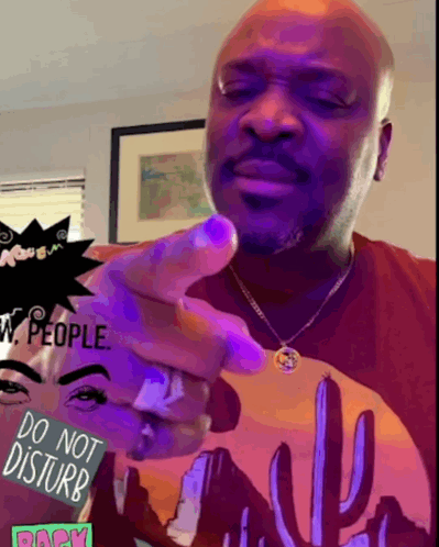 Man Pointing in Do Not Disturb Shirt