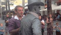 Man Poke Living Statue Gets Slapped GIF