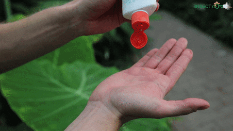 Man Pouring Insect Repellant Lotion GIF