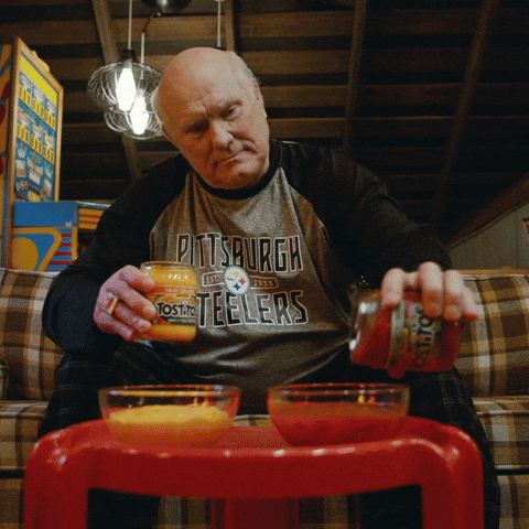 Man Pouring Salsa Into Bowls GIF
