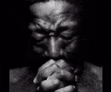 Man Praying with Folded Hands