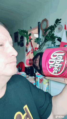 Man Pretending To Eat Dr Pepper Bottle GIF