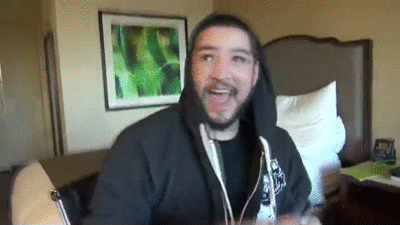 Man Proudly Showing Card GIF