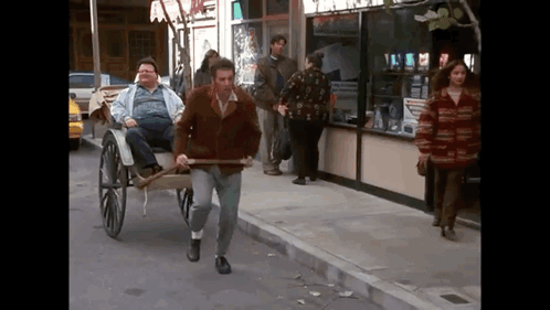 Man Pulling Horse-Drawn Carriage GIF