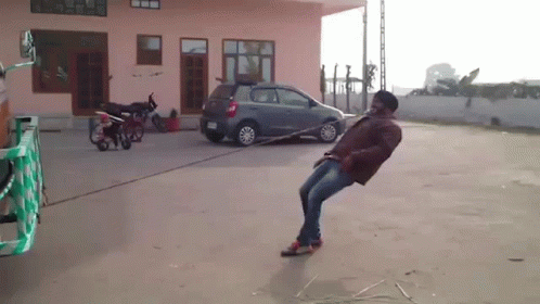 Man Pulling Truck By Mouth GIF
