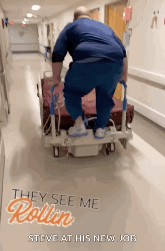 Man Pushing Hospital Bed With They See Me Rollin Steve
