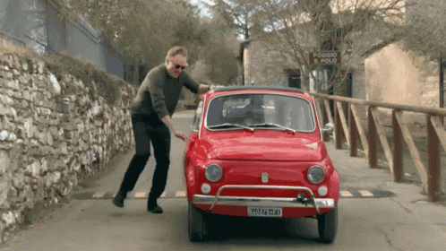 Man Pushing Red Car With Plate 2515 Jm - Gm GIF