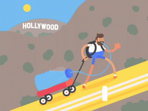 Man Pushing Wagon Up Hill in Hollywood
