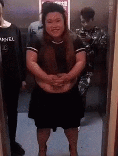 Man Pushing Woman Out Of Elevator GIF