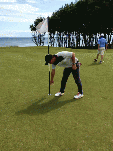 Man Puttin Golf Ball