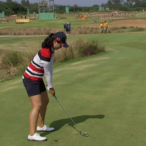 Man Putting Golf Ball on Green Putt Down Still Golfing Clown