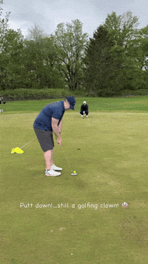 Man Putting Golf Ball With Putt Down Still Golfing Clown