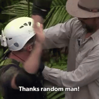 Man Putting Helmet on Another Man