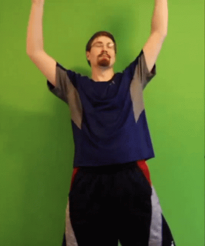 Man Raising Arms Blue Shirt Black Shorts