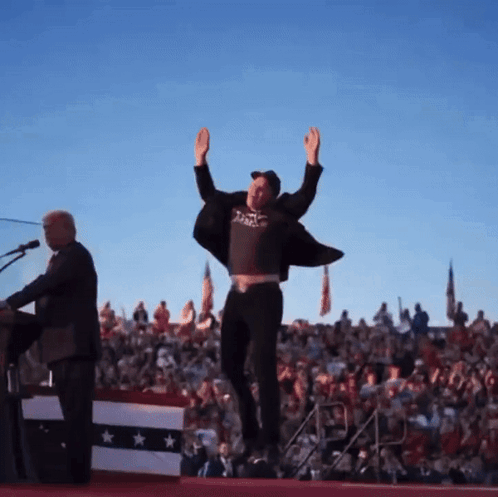 Man Raising Arms in Black Shirt Saying Justice