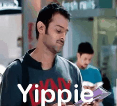 Man Reading Book with Yippie Shirt