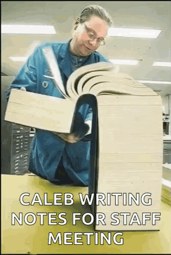 Man Reading Caleb Notes for Staff Meeting