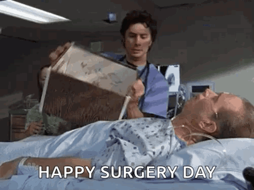 Man Reading in Hospital Bed, Doctor Holding Box