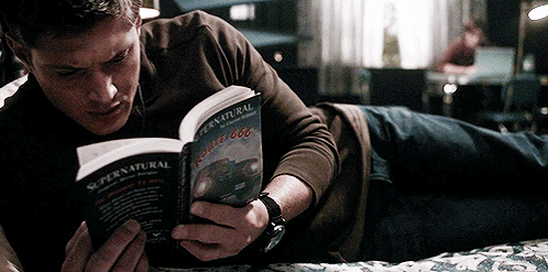 Man Reading Supernatural Book in Bed